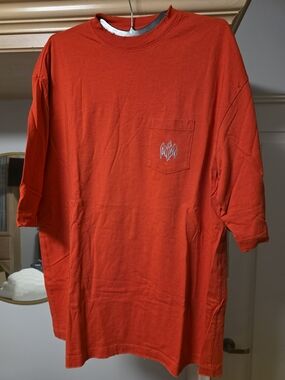 Warren Lotus Men's Red-Orange Short-Sleeve Pocket Tee with Subtle Chest Motif